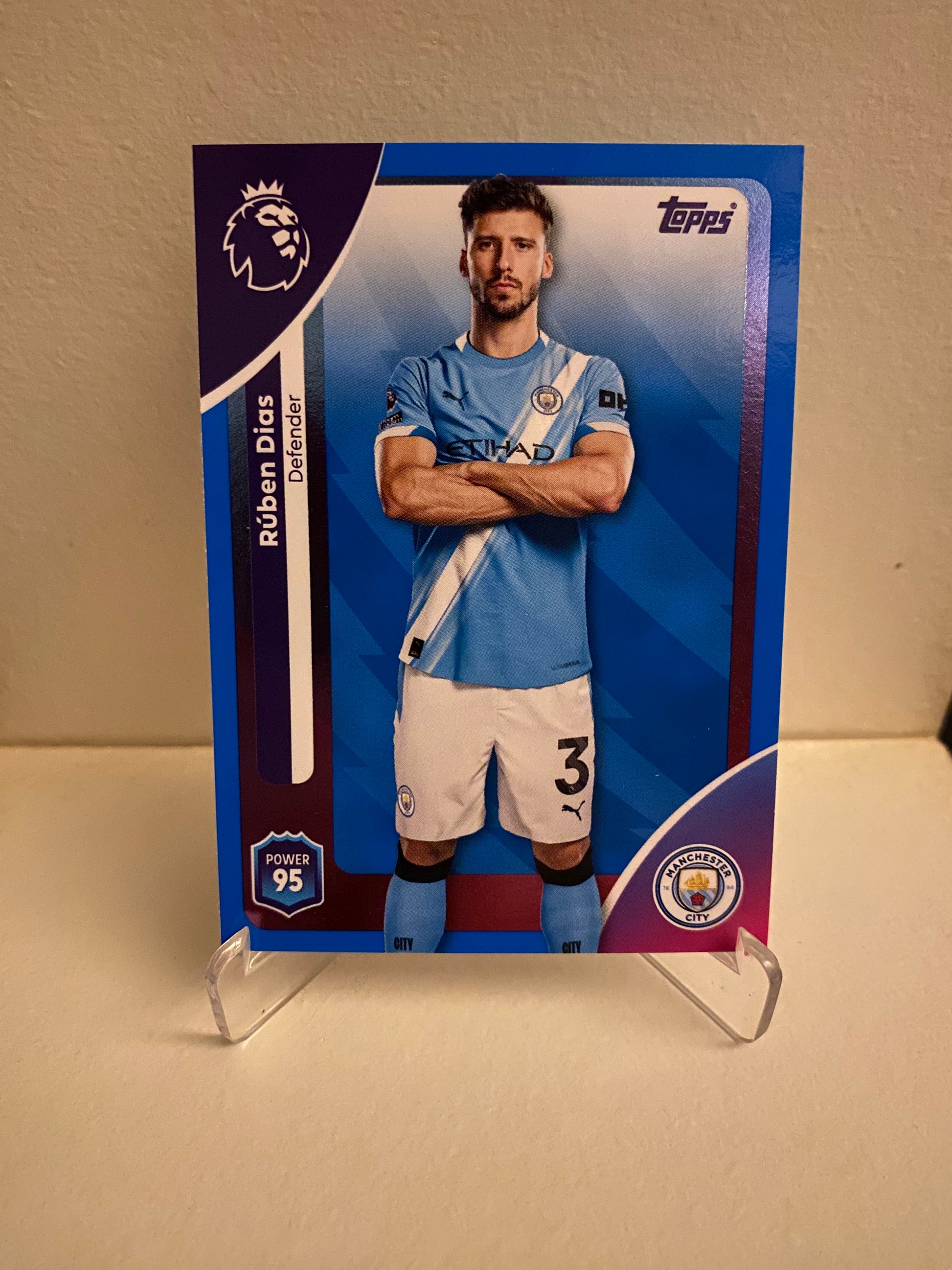 Fodbold kort Topps Premier League 2025/2026 - Blue Parallel Ruben Dias - Pokedexet